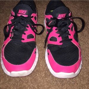 Pink Nike free run shoes